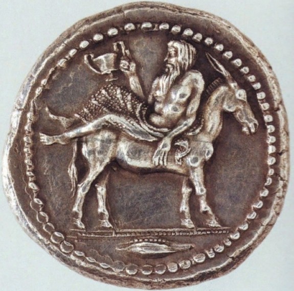 Бог Дионис верхом на осле на античной македонской монете