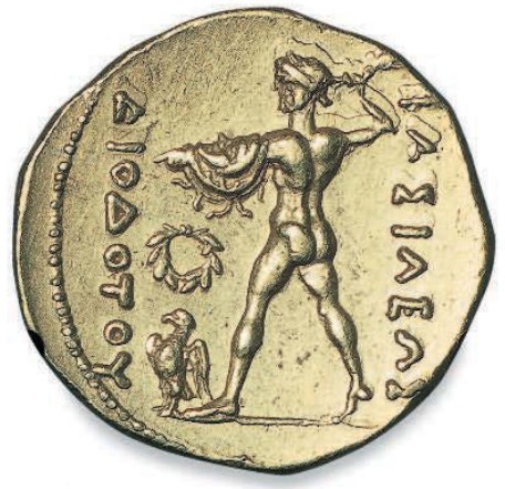 >На золотой монете изображен Зевс