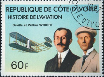 Почтовая марка с изображением братьев Райт и их самолета